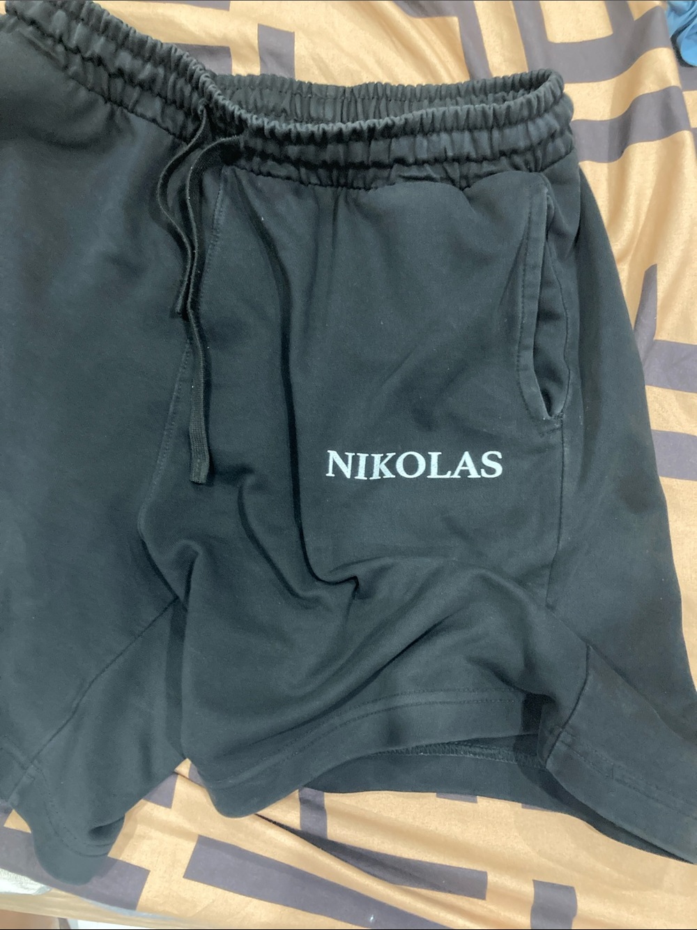 Black Athletic Shorts with White 'NIKOLAS' Logo